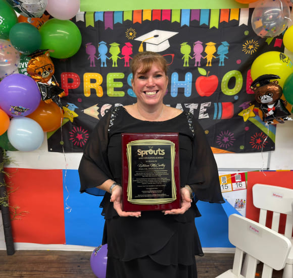 Director Kathleen McCarthy with preschoolers at Sprouts Academy